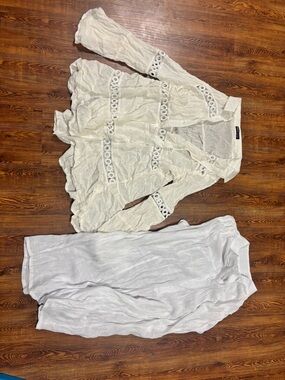White coverups. One sleeveless, one with long sleeves.